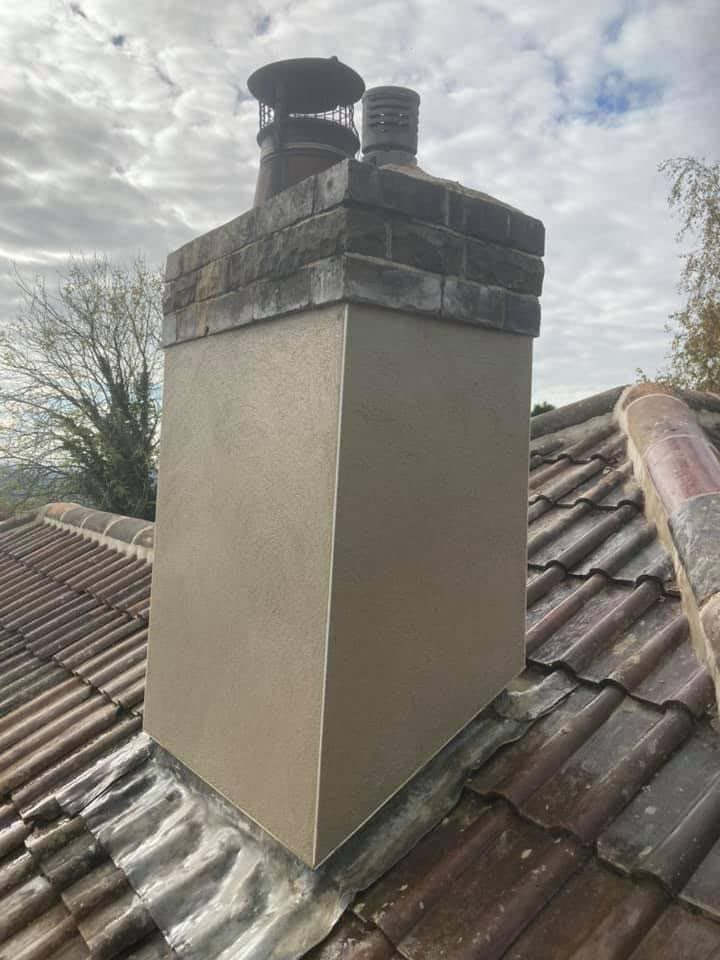 Rendered chimney stack with new lead flashing on a tiled roof, chimney repair in Somerset