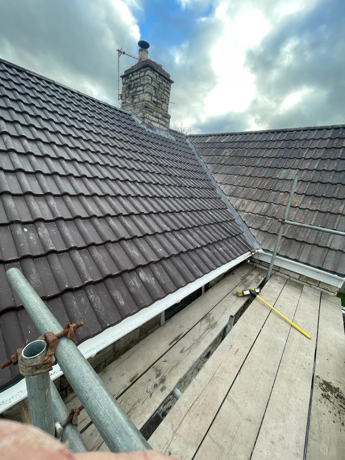 New lead valley and chimney flashing between two tiled roof slopes, leadwork in Glastonbury