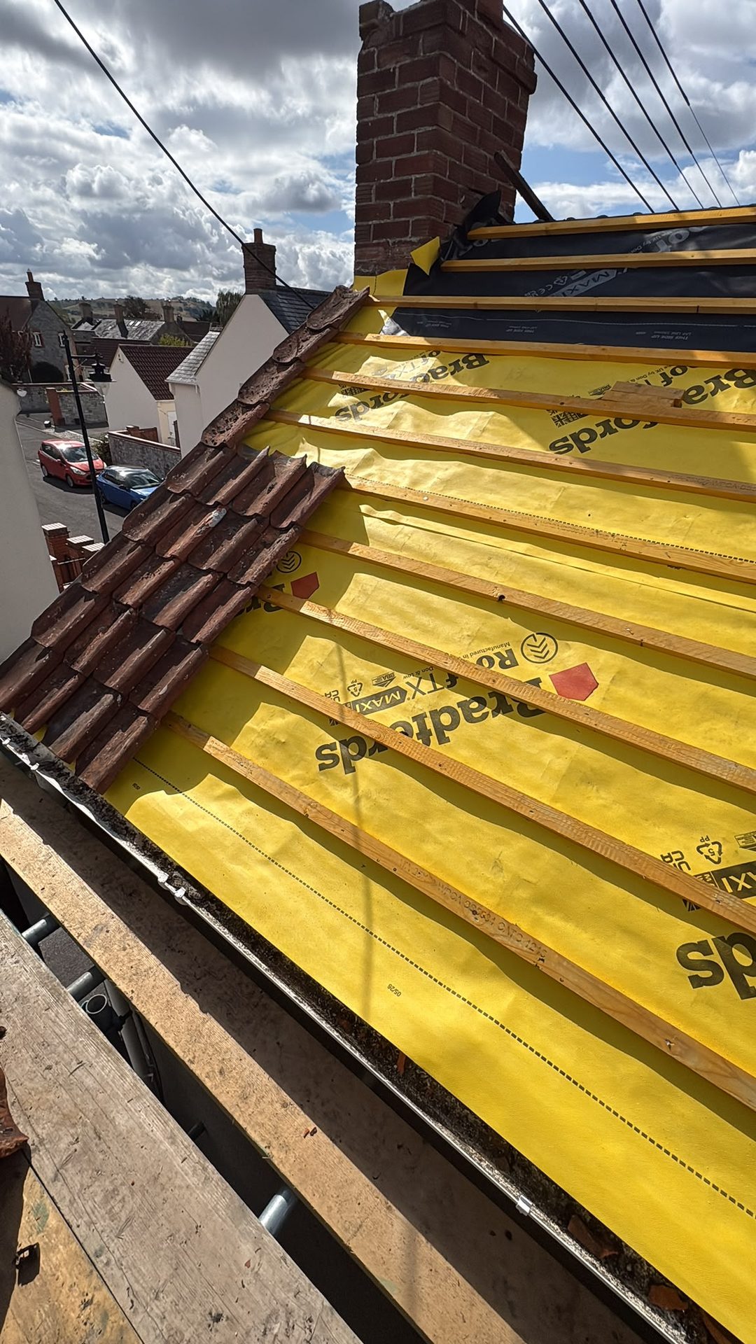 Roof stripped to new breathable membrane and battens during a re-roof, Somerset