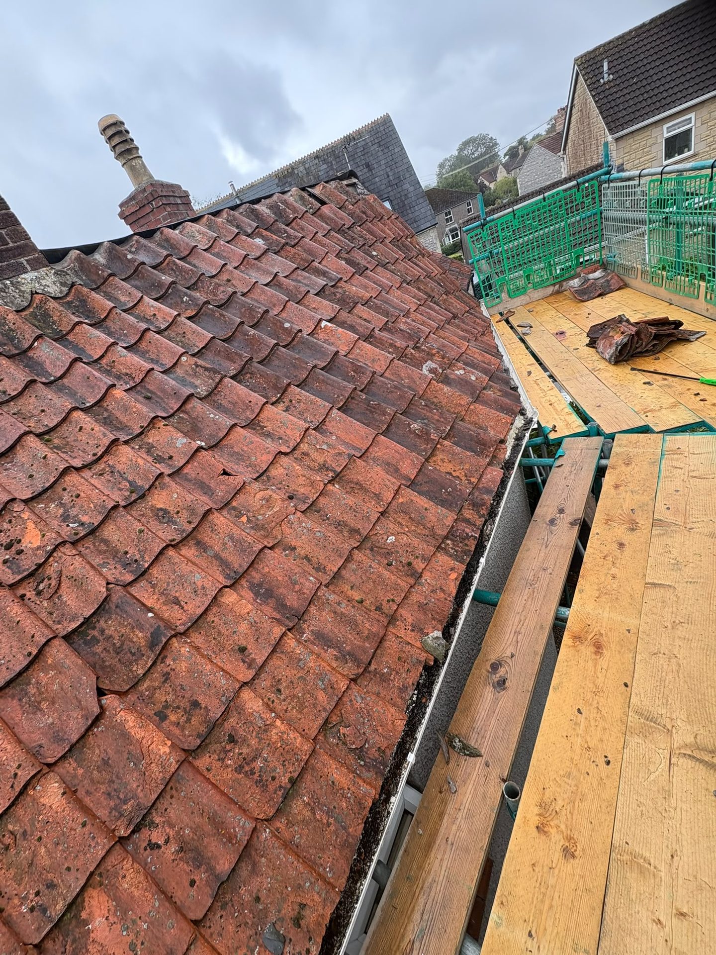 Clay pantile roof during roof repairs with scaffolding in place, Glastonbury, Somerset