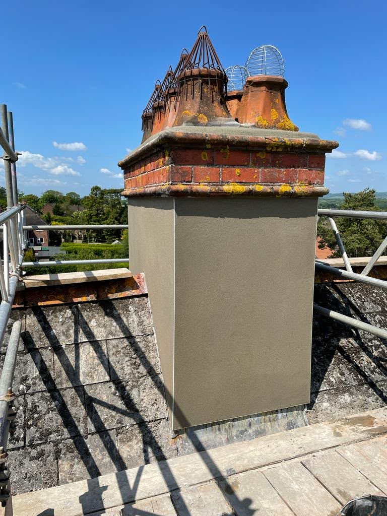 Victorian chimney with clay pots, newly rendered stack and lead flashing, Glastonbury chimney repairs