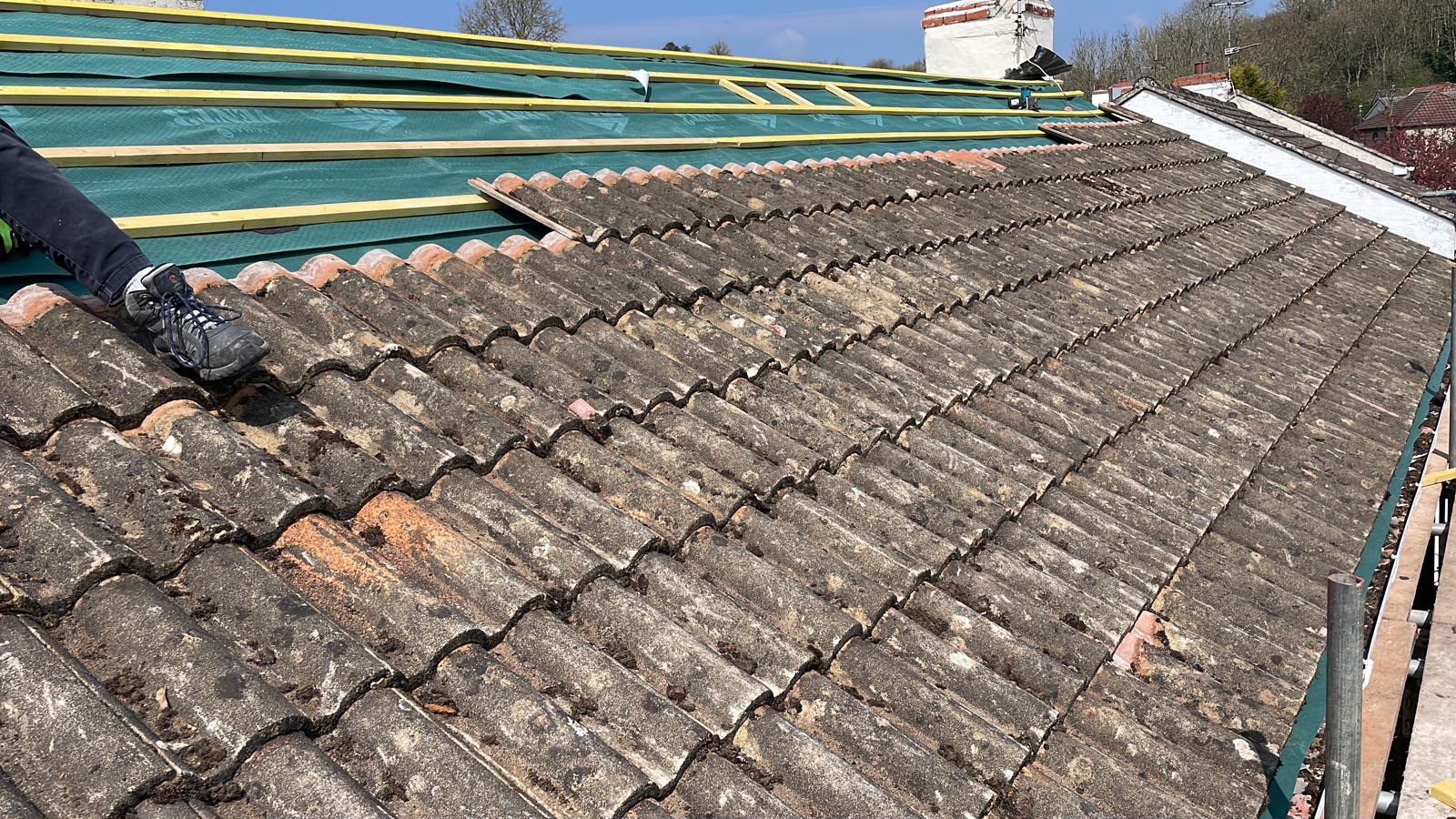 Old double roman tiles stripped back to new membrane and battens, re-roofing Glastonbury
